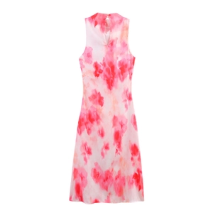 Detail view of the high neckline and teardrop back cutout on a tie-dye satin midi dress
