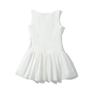 Detail view of white sleeveless dress showing fine pleated skirt and hidden back zipper