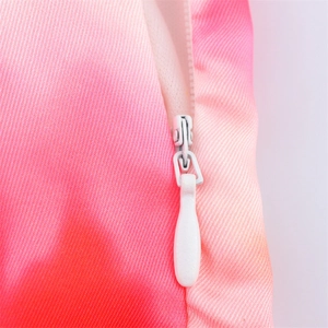 Close-up detail of the invisible zipper and tie-dye satin fabric on a midi dress