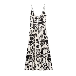 White halter maxi dress with black abstract print and open-back cut-out design