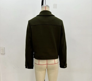 Rear view of dark green short wool jacket with zipper detail and lapel collar