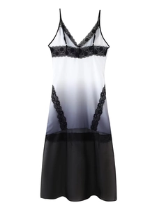 Detailed view of white and black gradient satin nightgown with elegant lace trim