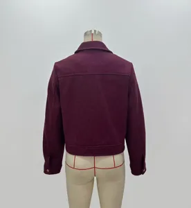 Back view of a cropped burgundy jacket with a classic lapel and buttoned cuffs