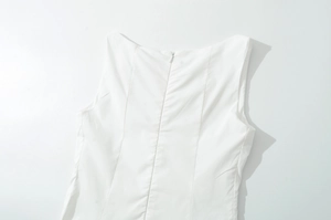 Close-up of invisible back zipper on white sleeveless floral embroidery dress