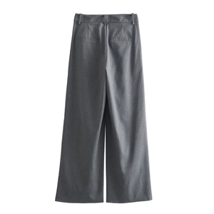 Detail view of gray pinstripe wide-leg trousers featuring hidden rear pockets and high-waist cut