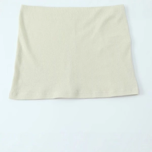 Chic apricot ribbed cotton tube top with vertical knit texture and slim fit