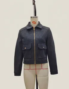 Close-up of dark grey short wool jacket with metal zipper and large chest pockets