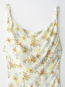Detail of cowl neck floral satin dress with thin straps and delicate print patterns