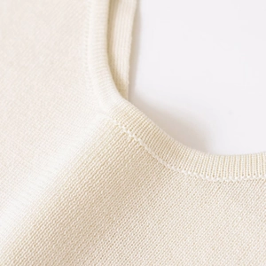 Elegant cream white backless knitted top for women featuring fine texture and round neck