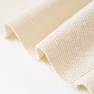 Women's backless knit top in cream white featuring premium ribbed texture and soft fabric