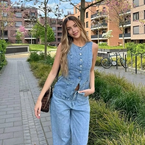 Women's sleeveless button-up denim vest and wide-leg jeans in light blue wash