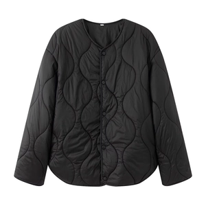Women black wave quilted lightweight jacket with snap buttons and collarless round neck design
