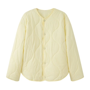 Women's light yellow quilted jacket with wavy stitching and button-front closure
