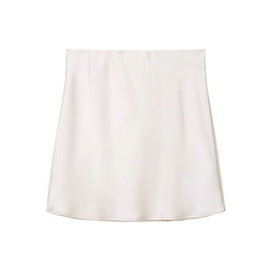 Detail of cream satin mini skirt showing smooth lustrous fabric and minimalist waistline
