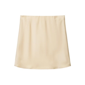 Detail view showing smooth satin fabric and subtle sheen of the cream mini skirt