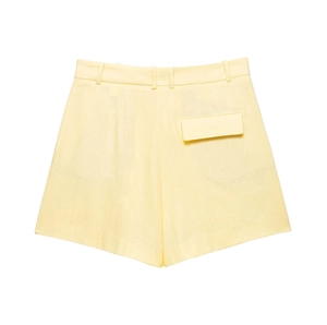 Detail view of light yellow high-waisted shorts in linen blend with decorative back pocket