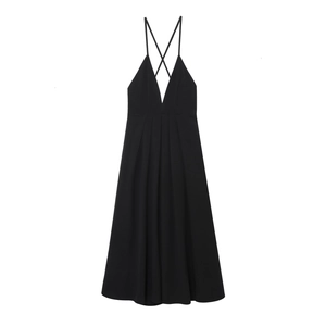 Detail of elegant black deep V-neck dress with pleated waist and delicate cross straps