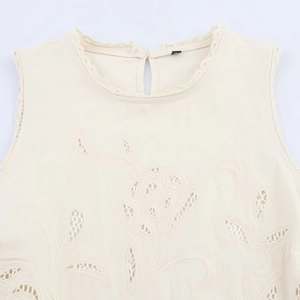 Elegant sleeveless cream top with floral embroidery and openwork lace details