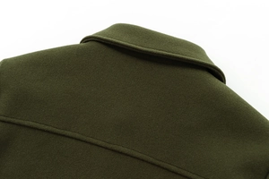 Close-up of the back collar and shoulder stitching on a dark green wool coat