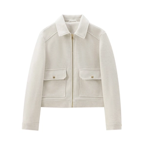 Minimalist cream short jacket with metallic gold zipper and dual flap pockets