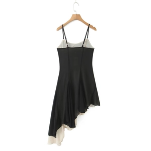 Women's chic black and ivory colorblock slip dress with an asymmetrical layered hem