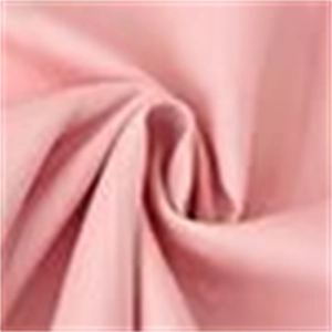Detailed view of soft pink fabric texture with elegant folds and drapery effects