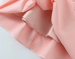 Detail of pink summer dress showing high-quality stitching and smooth inner lining