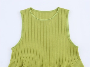 Detail of avocado green ribbed knit top showing textured vertical stripe fabric texture