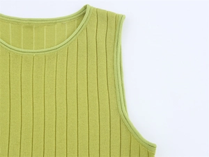 Detail of lime green ribbed knit sleeveless top with round neck and refined stitching