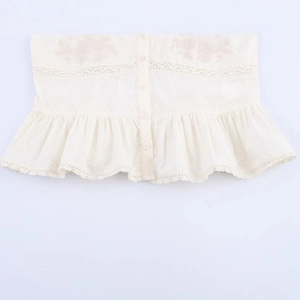 Haut bustier en dentelle blanc crème avec broderie florale et ourlet volanté