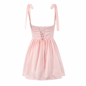 Elegant pink satin mini dress with adjustable bow straps and lace-up back design
