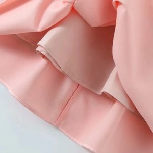 Pink multi-layered summer dress with detailed hemline and premium smooth fabric texture