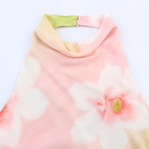 Halter neck floral print top with watercolor patterns and elegant metal buckle detail