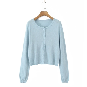 Light blue long sleeve knit cardigan with scalloped lace trim and round neck