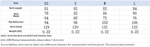 Detailed size chart for black and white checkered halter dress showing XS-L measurements