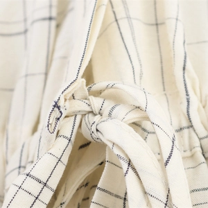 Women's plaid bomber shirt jacket in cream white with adjustable drawstring details