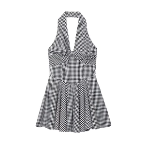 Classic black and white gingham halter neck dress with a front bow and pleated skirt