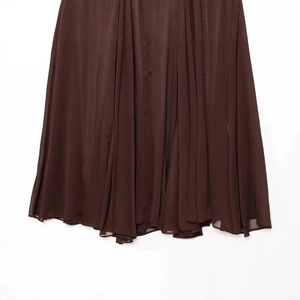Translucent pleated skirt in dark brown with soft draped texture for spring style