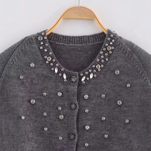 Women's dark grey knit cardigan with sparkling rhinestone and gemstone neckline decor