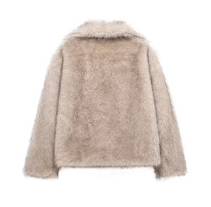 Close-up of the fluffy faux fur texture and gradient dye detail on the stylish winter coat