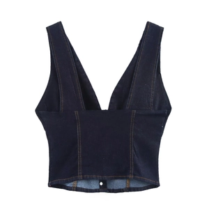 Detail of dark blue denim vest with deep V-neck and contrasting orange topstitching