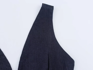 Close-up of deep blue denim fabric texture and high-quality stitching details