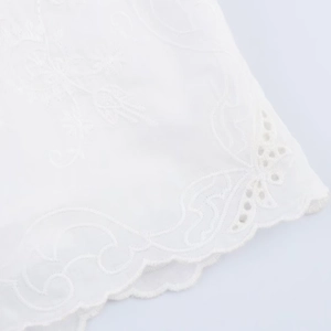 White pajama shorts with delicate flower embroidery and elegant scalloped edges