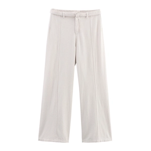Detail view of light beige wide-leg denim trousers with stitched center pleats