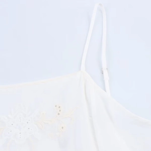 White camisole top with floral embroidery and adjustable straps for women