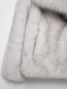 Close-up macro view of soft gradient grey long-hair faux fur texture with silky finish