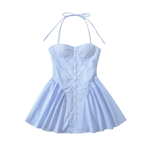 Detail of light blue striped halter dress with white buttons and pleated flared hem