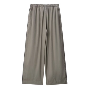 Detail of wide-leg trousers in taupe with elastic waistband and side stripe accents