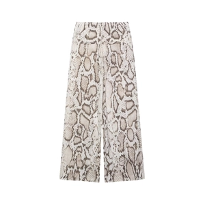 Detail of high-waisted wide-leg trousers with elegant snakeskin print pattern in beige and brown