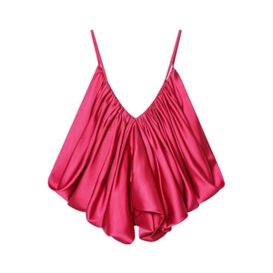Detailed view of magenta satin top featuring fine accordion pleats and thin shoulder straps